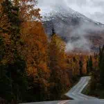 eklutna lake image of road with mountains in background moody fall pretty alaska